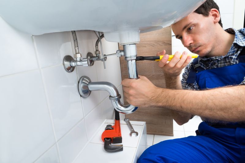 Plumber Installing a Sink